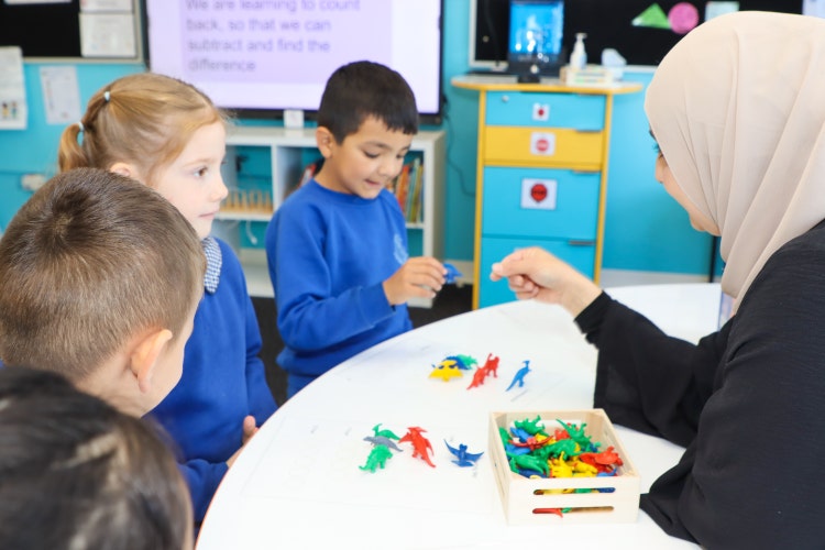 teacher and students in a maths lesson